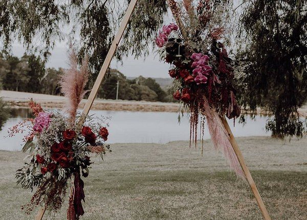 Pampas Grass Wedding Arch with burgundy deep red roses 3