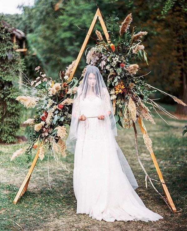 geometric wedding backdrop with florals