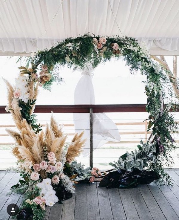 pampas grass and greenery wreath wedding backdrop