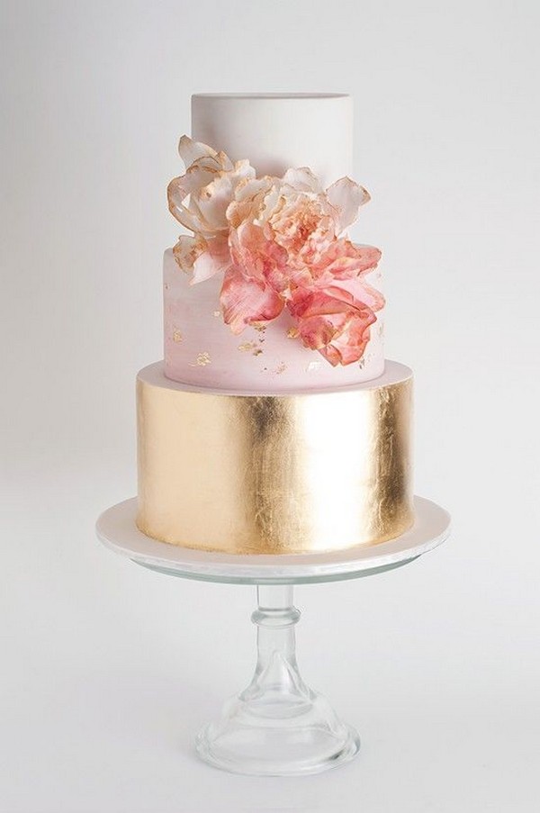 Gold tier wedding cake with ombre flowers