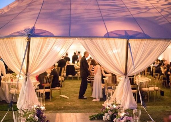Outdoor romantic wedding tent lighting and layout idea