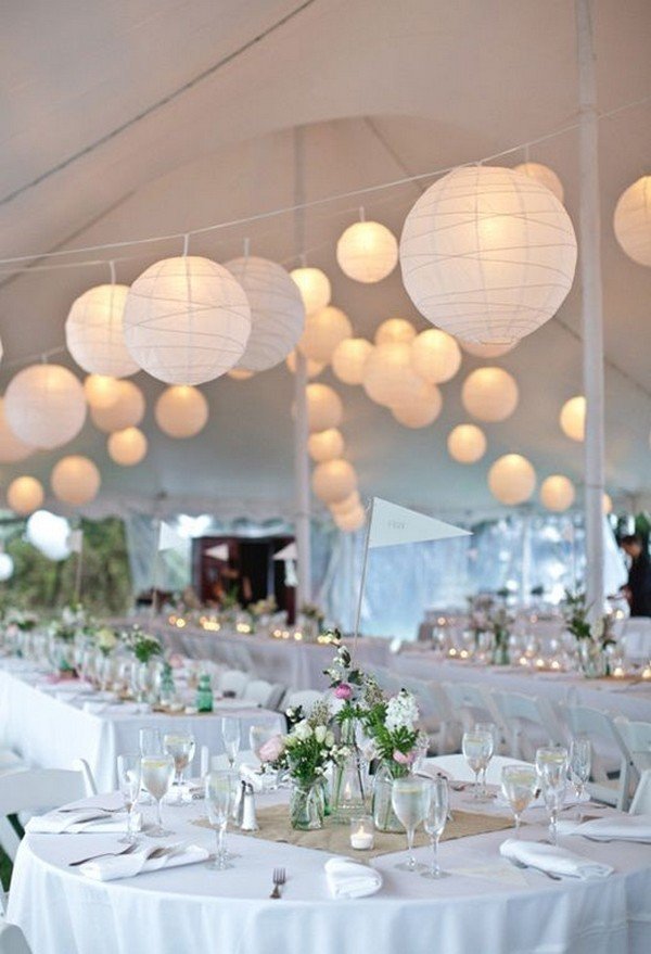 trending tented wedding reception ideas with greenery chandelier