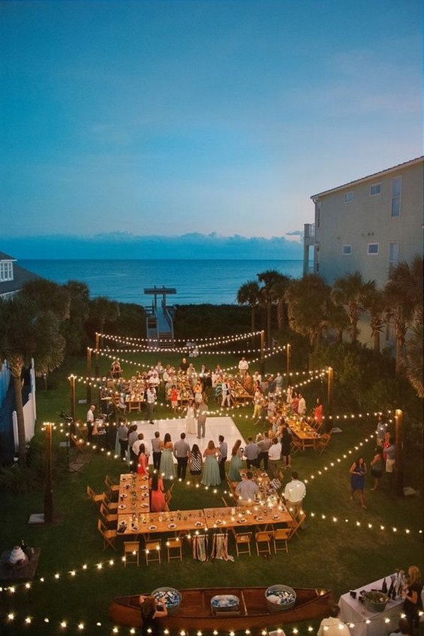 beach side night wedding reception ideas with string lights