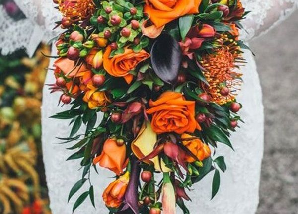 cascading wedding fall bouquet with purple and orange flowers