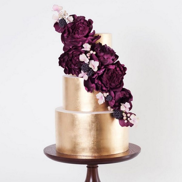 gold metallic cake with marsala hued sugar flowers