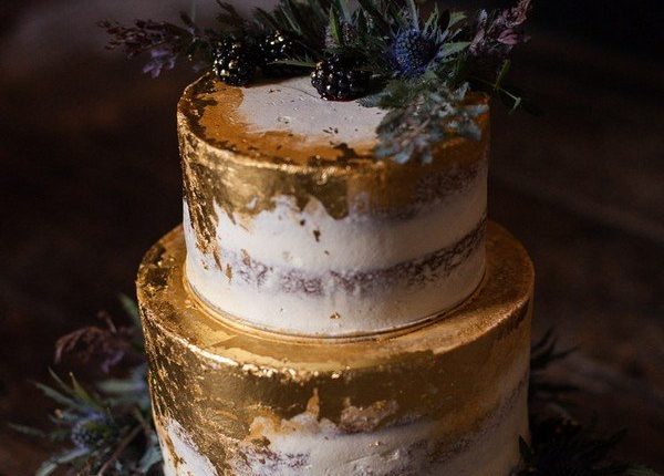 metallic gold wedding cake ideas with greenery