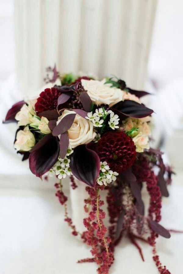 ream Roses & Spray Roses, White Waxflower, Maroon Dahlias, Aubergine Calla Lilies, Red Amaranthus + Burgundy Foliage