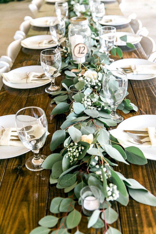 Long Feasting Table with Garland Greenery Centerpieces and Wooden Farm Tables