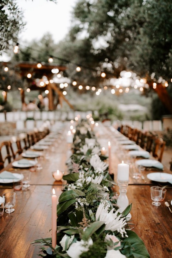 Lush florals and pink accents tropical outdoor wedding reception table decoration idea