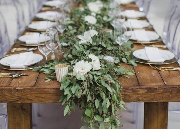 seeded eucalyptus and white flowers wedding garland centerpiece
