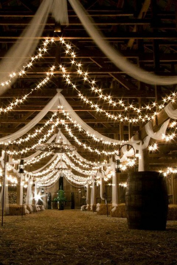 barn wedding reception ideas with draping fabric and lighting