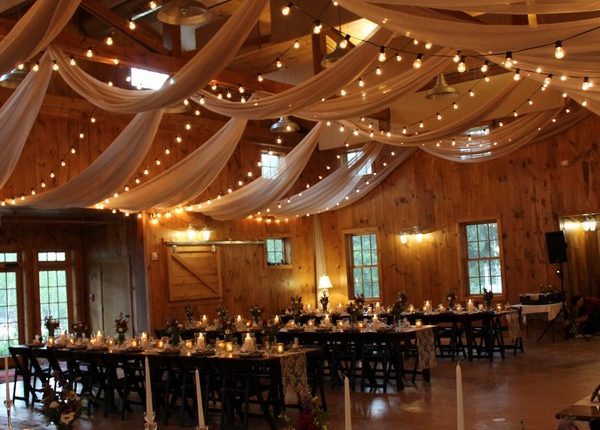 country barn wedding reception ideas with fabric and lighting