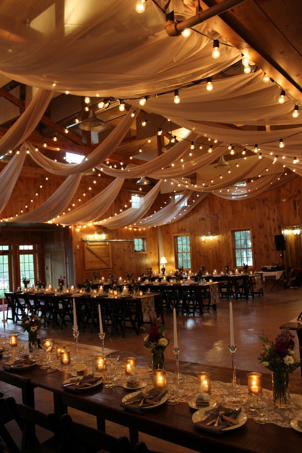 country barn wedding reception ideas with fabric and lighting