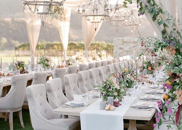 elegant outdoor wedding reception ideas with greenery and fabric draping