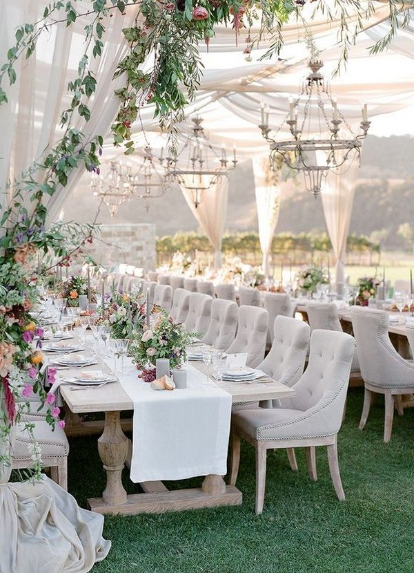 elegant outdoor wedding reception ideas with greenery and fabric draping