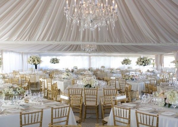 elegant romantic chandelier with dramatic draping tent wedding decor