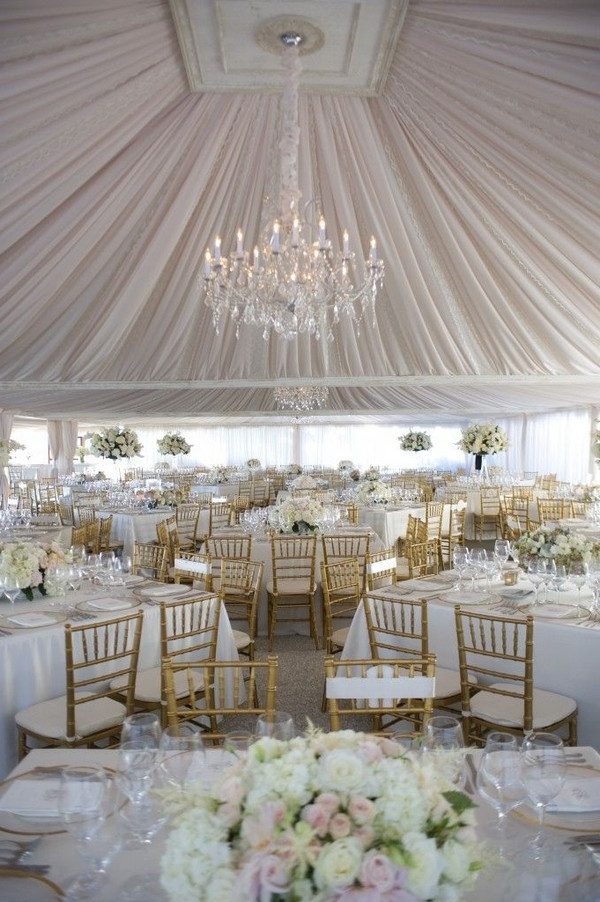 elegant romantic chandelier with dramatic draping tent wedding decor