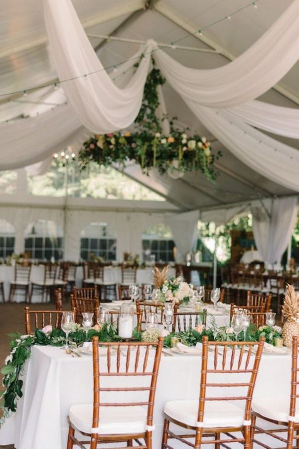 elegant tent wedding reception ideas with greenery and white draping