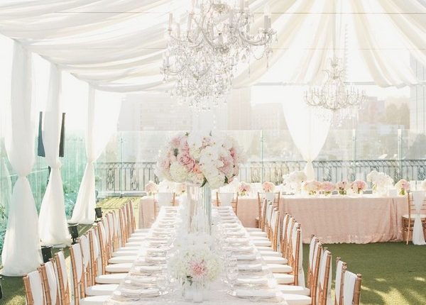 elegant tent wedding reception with ivory draping fabric