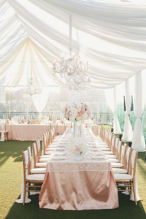 elegant tent wedding reception with ivory draping fabric