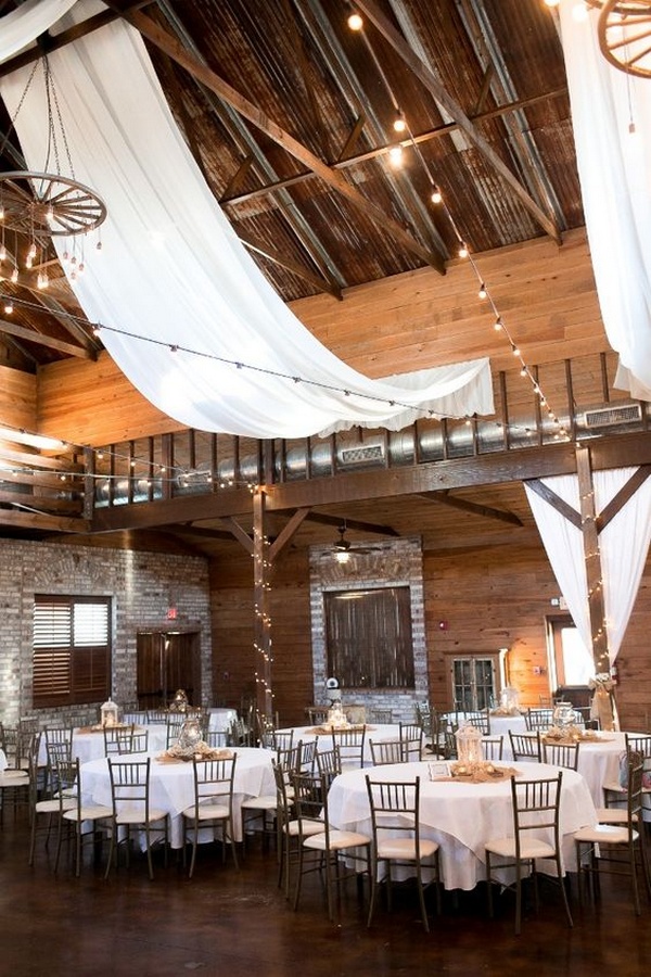 fabric draped barn wedding reception with string lights