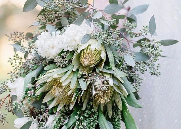 greenery wedding bouquet with king protea