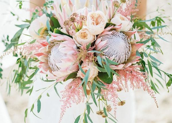 pink king protea and greenery wedding bouqut