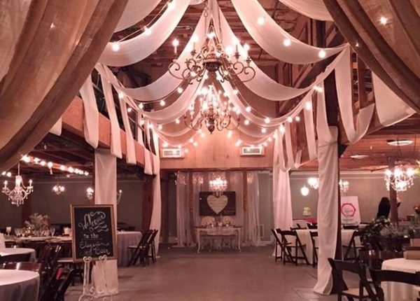 vintage barn wedding reception ideas with draping fabric