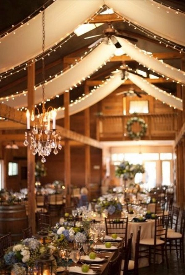 vintage barn wedding reception ideas with draping fabric and lighting