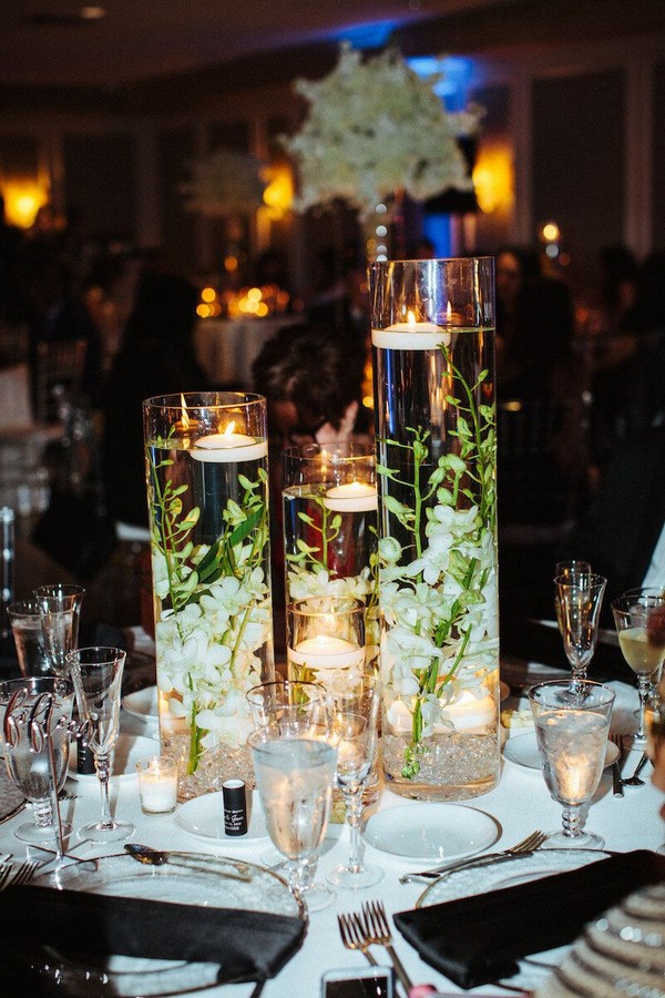 Centerpieces with Floating Candles and White Florals