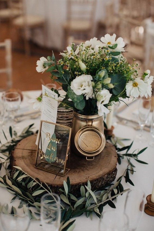 chic greenery wedding centerpiece ideas with tree stump