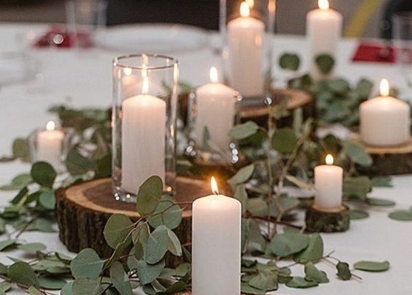 greenery diy wedding centerpiece ideas with candles and tree stumps