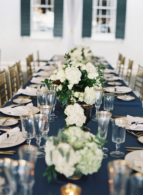navy blue gold and greenery long table wedding decorations