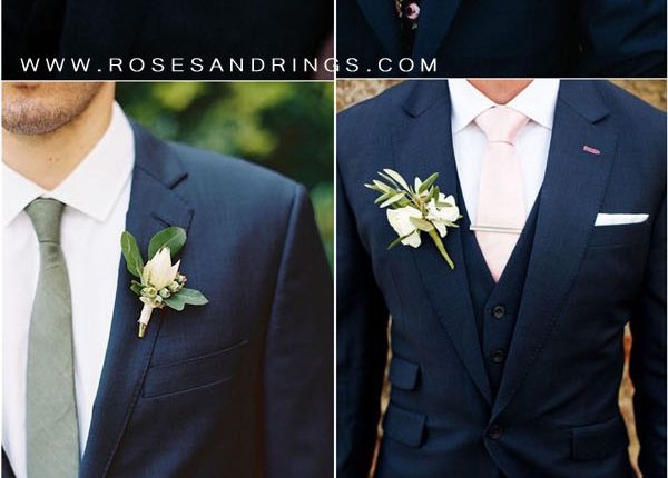 navy blue groom attire and tie and boutonniere