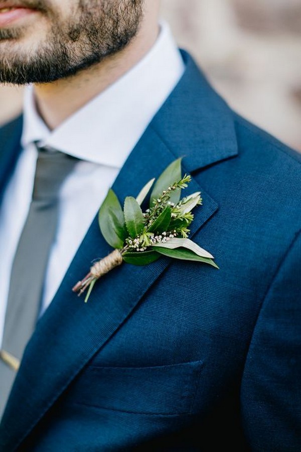 navy blue grooms suit with greenery boutonniere