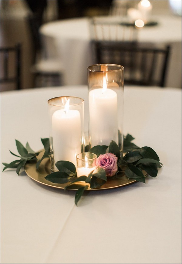 candle wedding centerpiece purple and greenery centerpiece