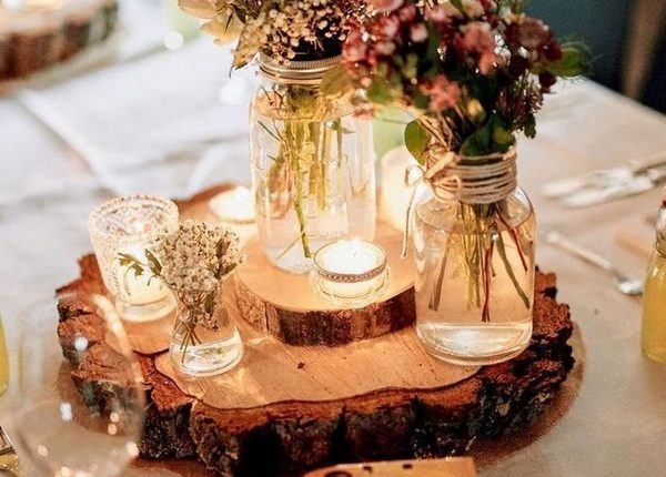 wildflowers and tree stump wedding centerpiece