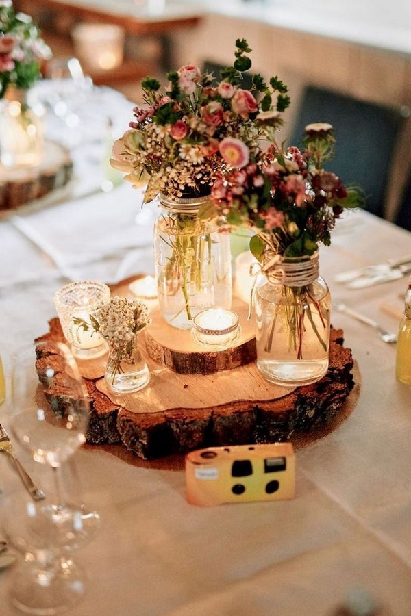 wildflowers and tree stump wedding centerpiece