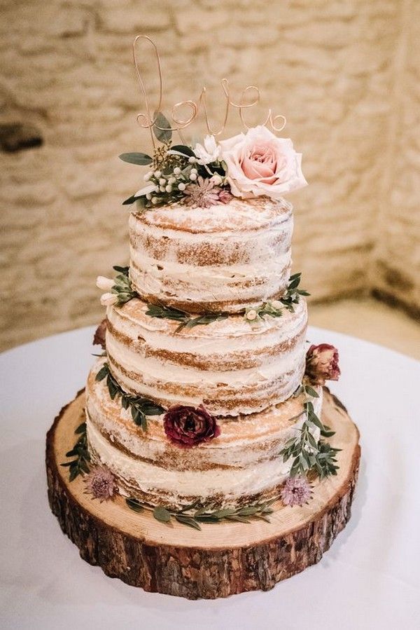 naked rustic wedding cake with tree stump stand