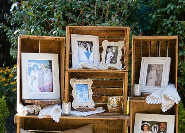vintage photo display ideas with frames & old wooden crates for outdoor wedding decor