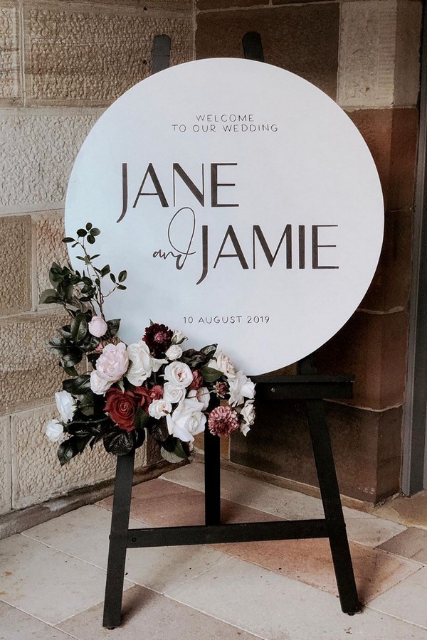 minimalistic round welcome signs with winter florals