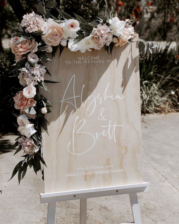 rustic raw wood and white tones wedding sign