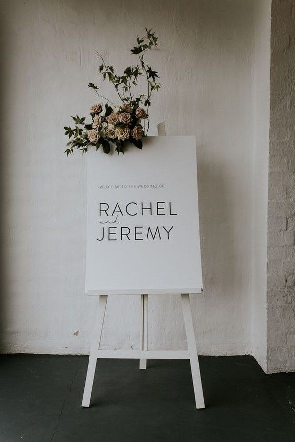 white wedding welcome sign with floral detail