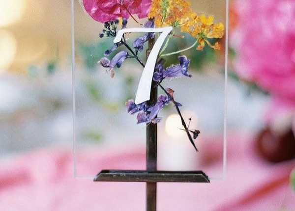 Clear acrylic wedding table number with pressed flowers