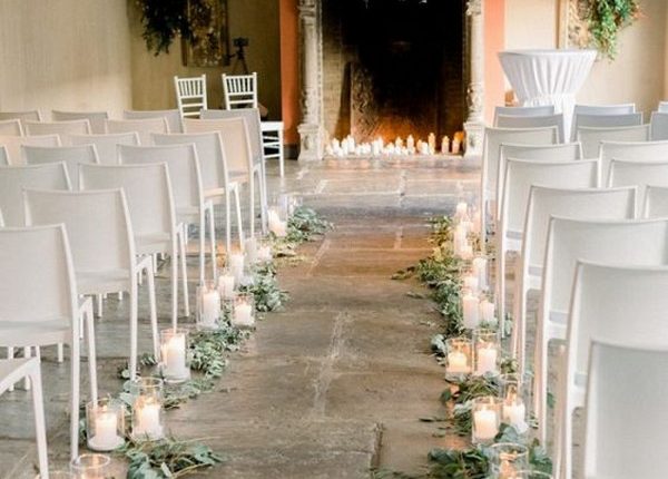 Indoor wedding ceremony with fireplace altar