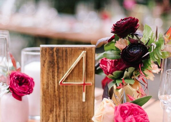 colorful modern wedding centerpiece with wood table number