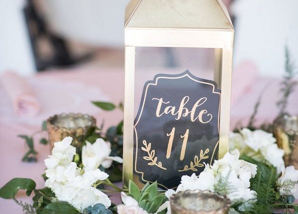 gold lantern wedding centerpiece with table number