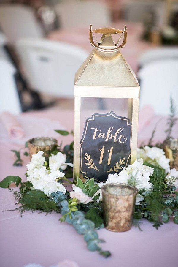 gold lantern wedding centerpiece with table number