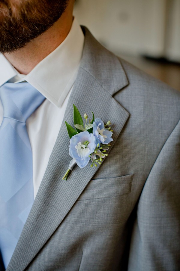 light blue delphinium blooms groom boutonnieres