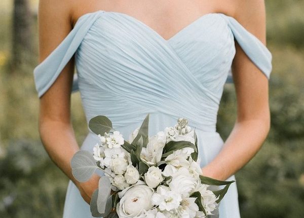 light blue off the shoulder bridesmaid dress and white bouquet